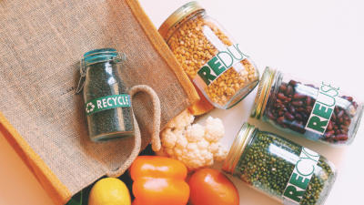 Assortment of jars, vegetables, and a tote bag